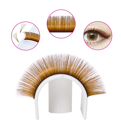 Detailed applied view of fluffy brown volume lash extensions on model's eyes