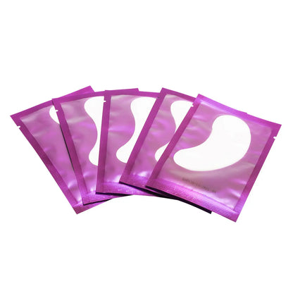 Under-eye gel patches isolating lower lashes during lash extension application