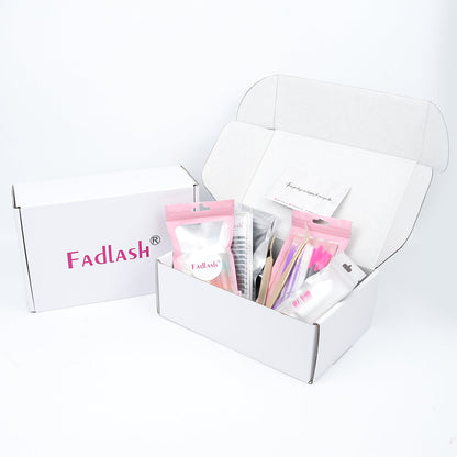Full eyelash extension starter bundle with premium gold tweezers on pink background.